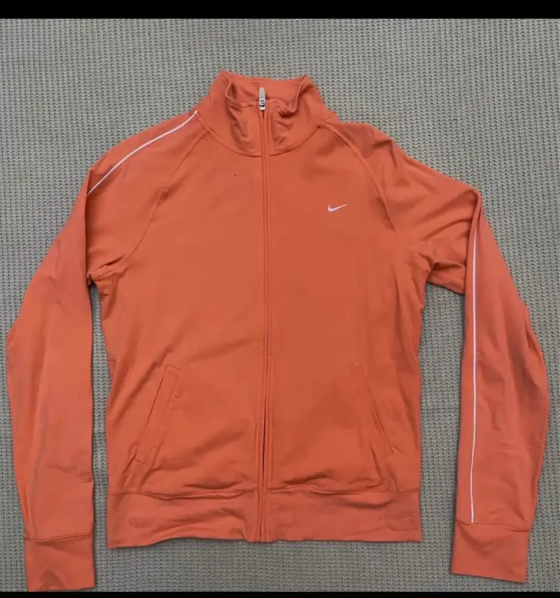 Chaqueta deportiva Nike Fit naranja para mujer