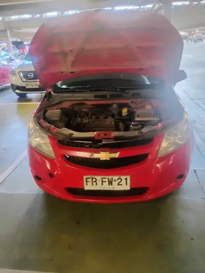 Auto Chevrolet Aveo Rojo en Buen Estado - miniatura 4