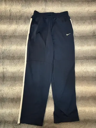Pantalones deportivos Nike azul marino con franjas - miniatura 1