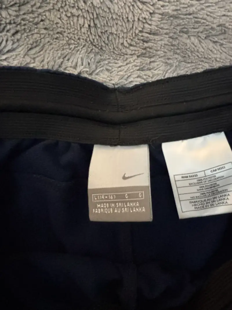 Pantalones deportivos Nike azul marino con franjas - 4