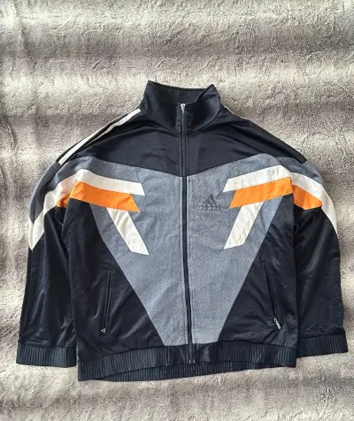 Chaqueta deportiva Adidas con diseño geométrico - miniatura 1