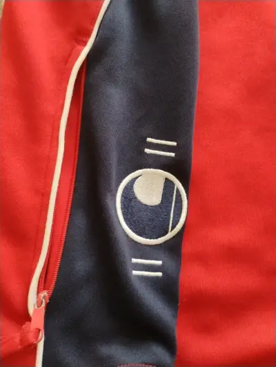 Chaqueta deportiva Uhlsport roja y azul - miniatura 2