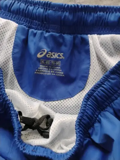 Pantalones deportivos Asics azul para hombre - miniatura 1