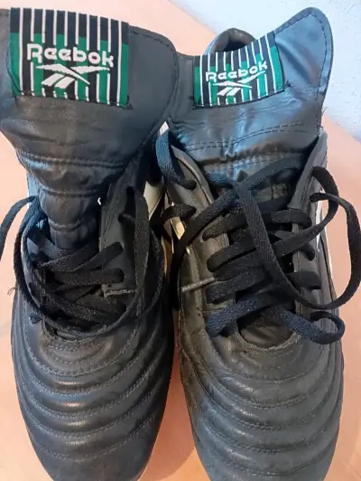 Botines de fútbol Reebok negros con tacos - miniatura 1