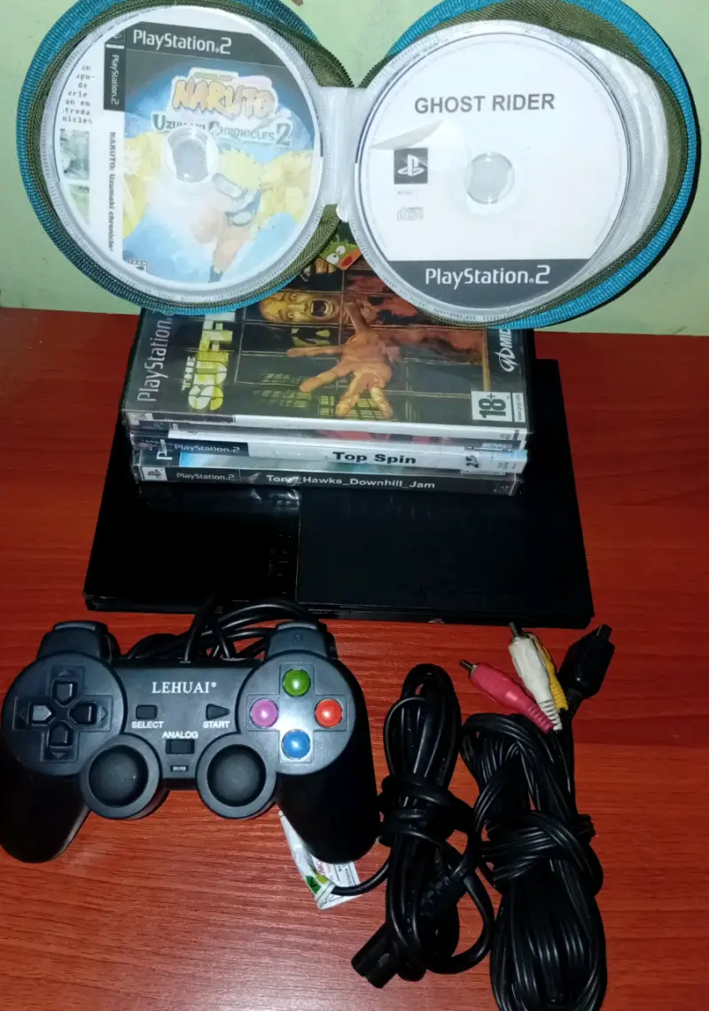 Consola PlayStation 2 con juegos y control