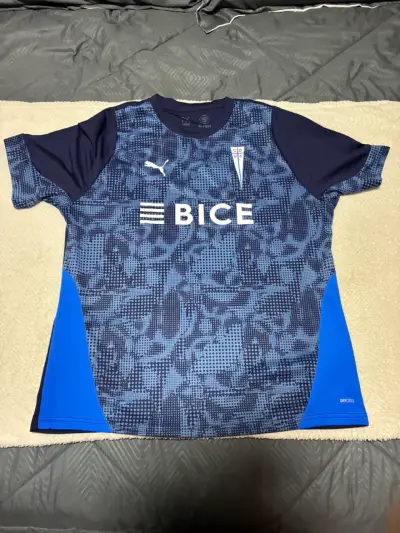 Camiseta Entrenamiento UC  Puma azul con logo BICE - miniatura 1