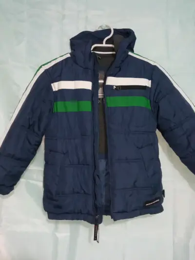 Chaqueta acolchada azul con capucha para niño - miniatura 1