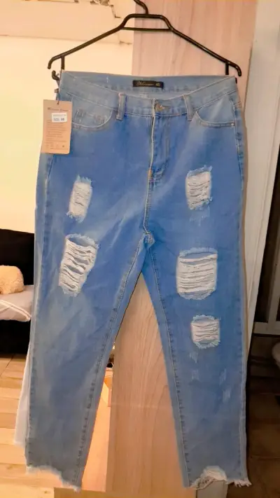 Jeans rasgados para mujer en varios colores - miniatura 1