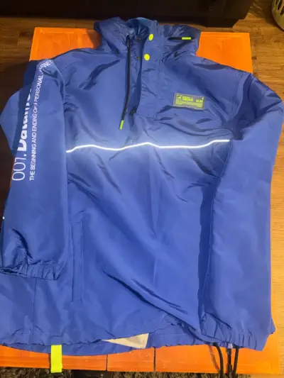 Chaqueta cortaviento azul Below con capucha XL - miniatura 1