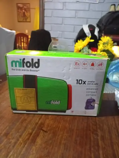 Asiento elevador portátil para niños Mifold - miniatura 1
