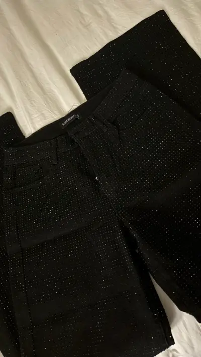 Pantalones negros con brillo Kiss Beauty - miniatura 1