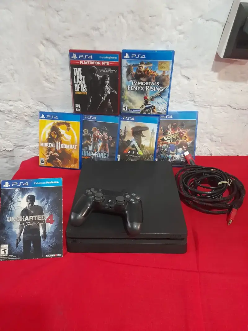 Consola PS4 con juegos y control