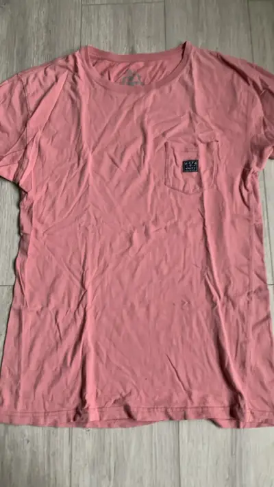 Polera rosada con bolsillo delantero - miniatura 1