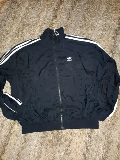 Chaqueta deportiva negra Adidas con rayas blancas - miniatura 1