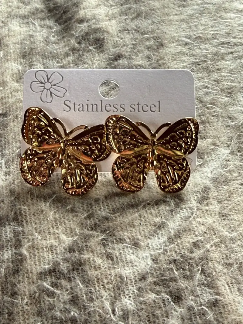 Set de aros de acero inoxidable dorados con diseño floral - 4