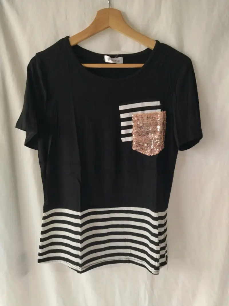 Polera con bolsillo de lentejuelas - 1