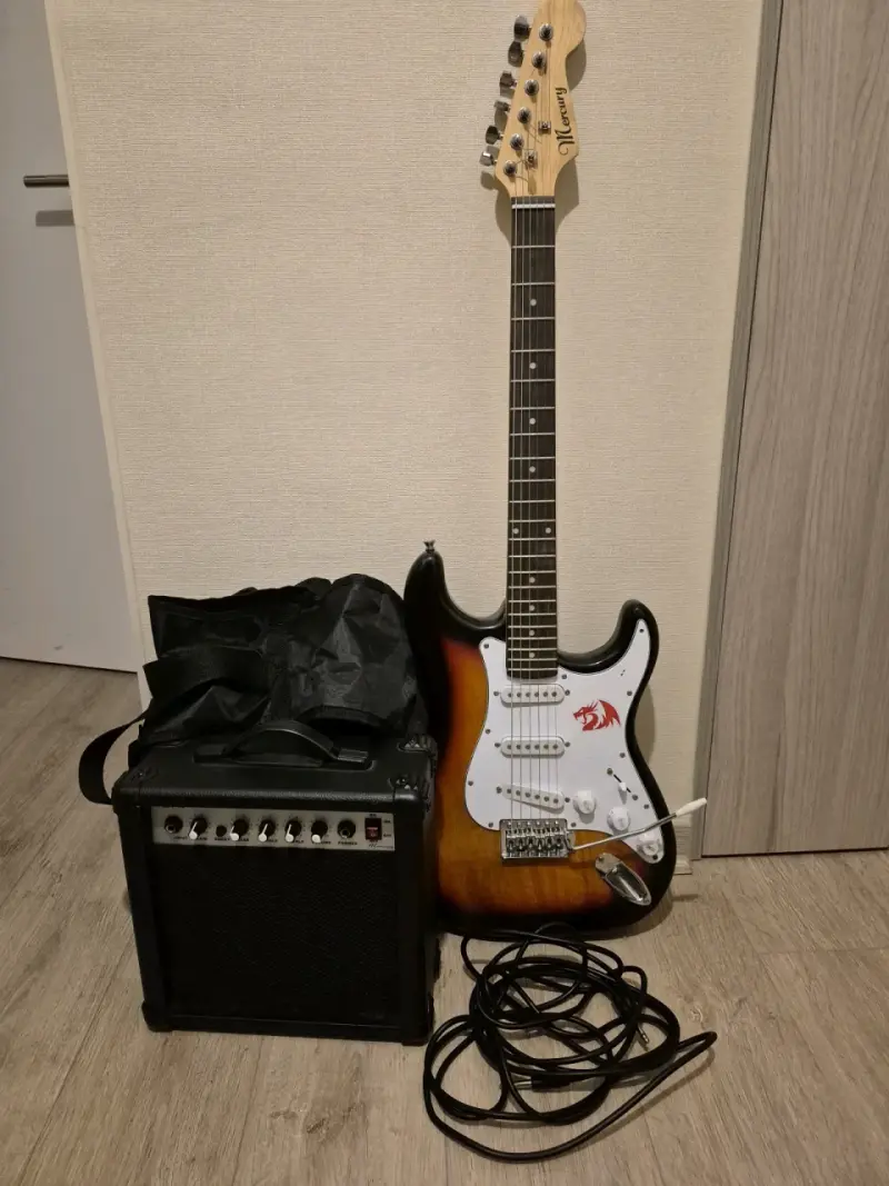 Guitarra eléctrica con amplificador y accesorios
