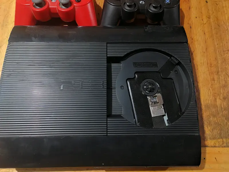 Consola PS3 con dos controles y Magia - 2