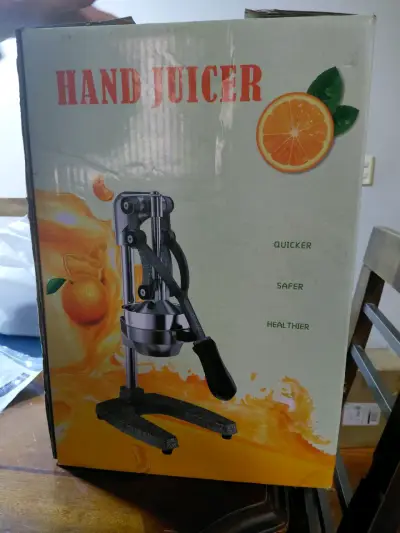 Exprimidor manual de acero inoxidable - miniatura 1