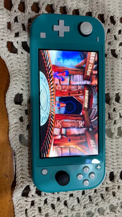Nintendo Switch Lite turquesa desbloqueada( magia) - miniatura 5