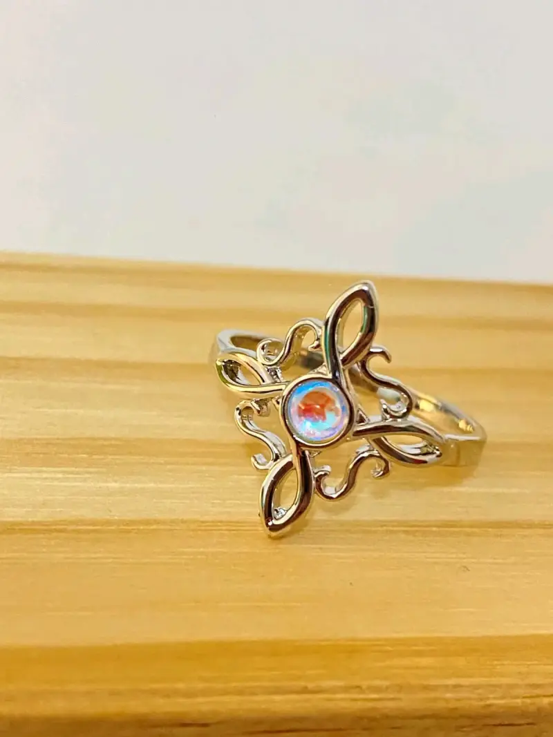 Anillo baño plata con diseño floral y piedra azul - 1