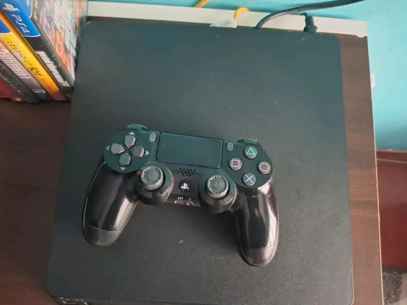 Consola PS4 con control y juegos incluidos