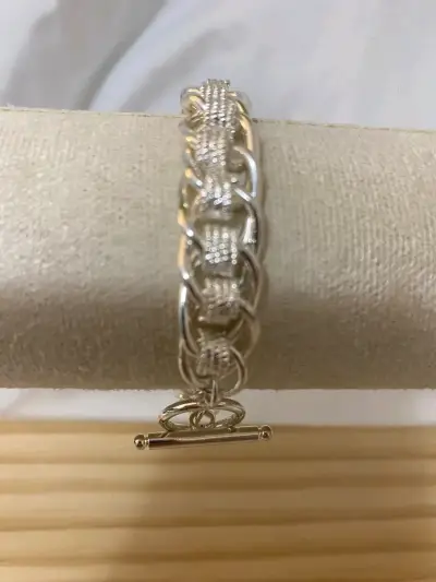 Pulsera de plata con diseño trenzado elegante - miniatura 1