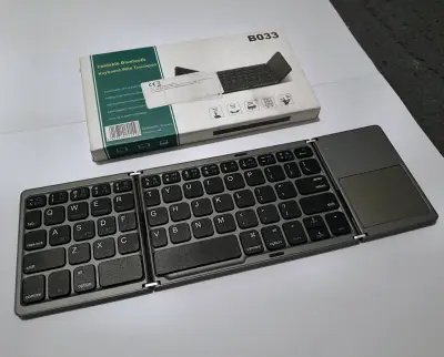 Teclado Bluetooth Plegable con Touchpad B033 - miniatura 1