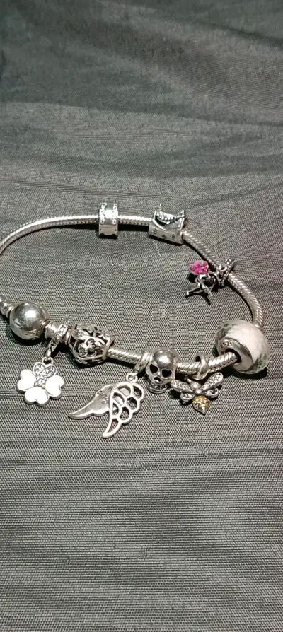 Pulsera de plata con dijes variados - miniatura 4