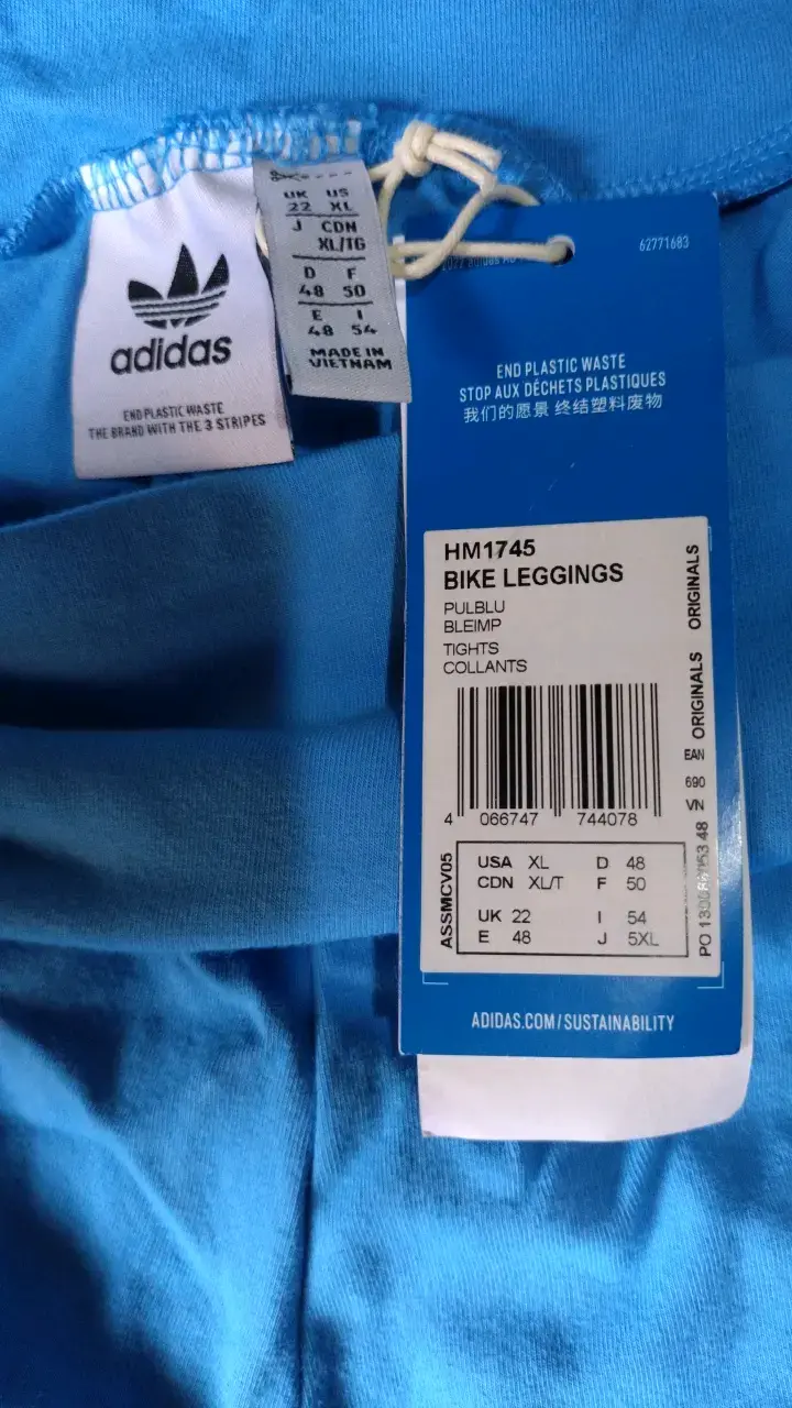Leggings cortos azules Adidas con franjas naranjas - 4