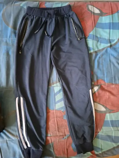 Pantalón deportivo azul con bolsillos y cierre - miniatura 1