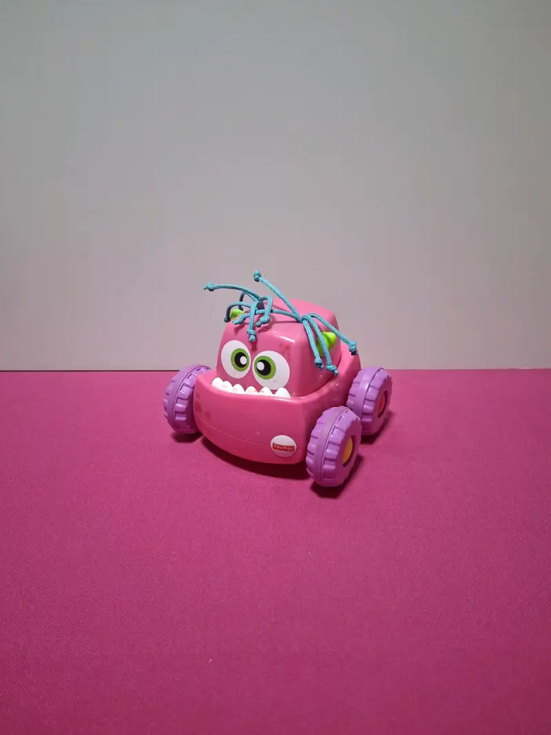 Auto de juguete Fisher-Price rosa para niños