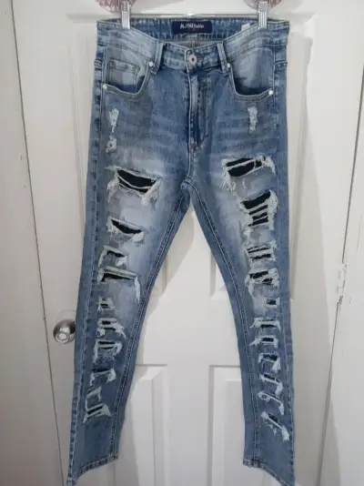 Jeans de mezclilla rasgados para hombre - miniatura 1