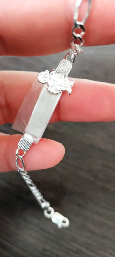 Pulsera de plata con diseño de niña o niño - miniatura 1