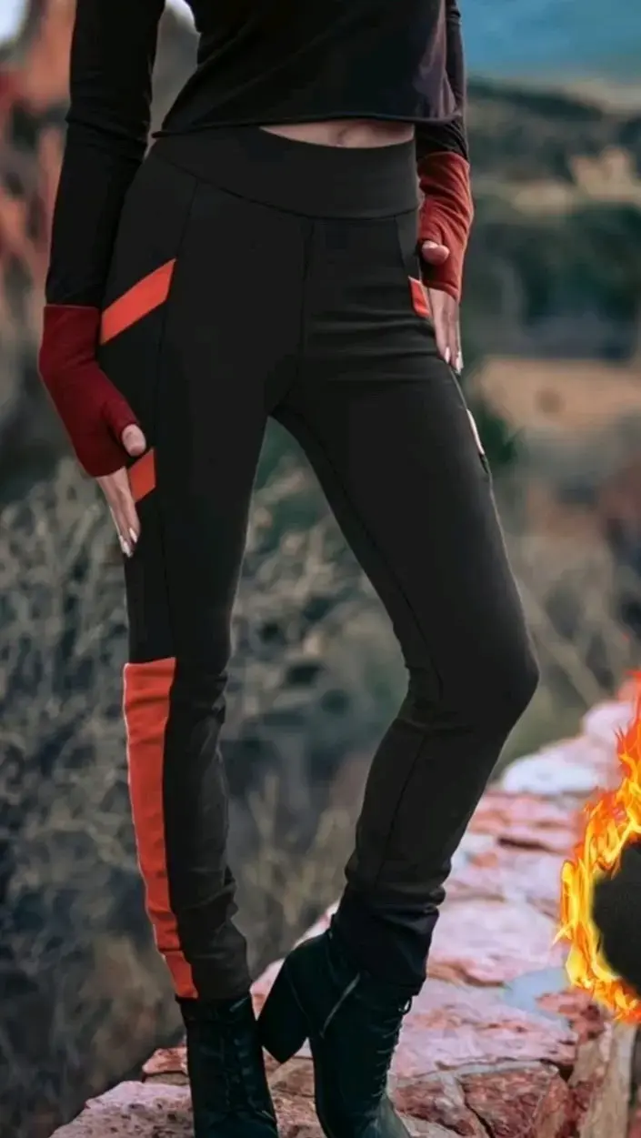 Pantalones deportivos negros con detalles rojos