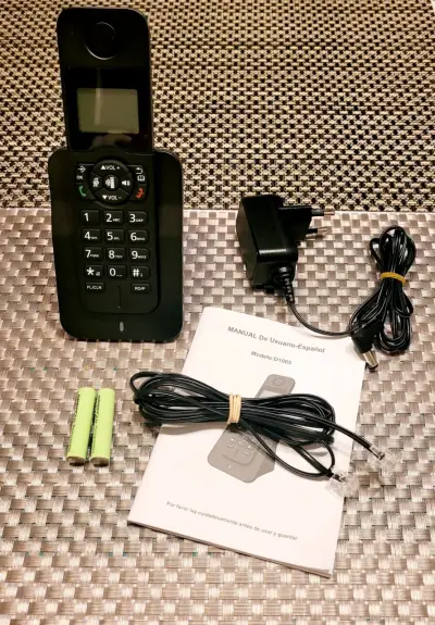 Teléfono inalámbrico con cargador y manual - miniatura 2
