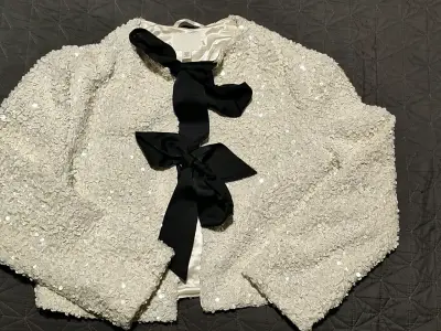 Chaqueta de lentejuelas blanca con lazo negro H&M - miniatura 1