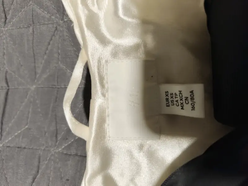 Chaqueta de lentejuelas blanca con lazo negro H&M - 2