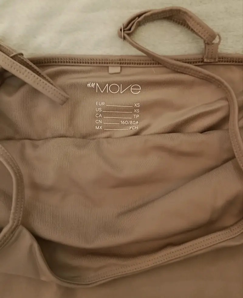 Top deportivo beige H&M Move - 2