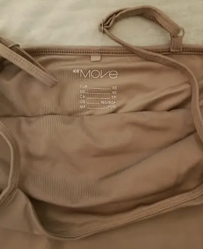 Top deportivo beige H&M Move - miniatura 2