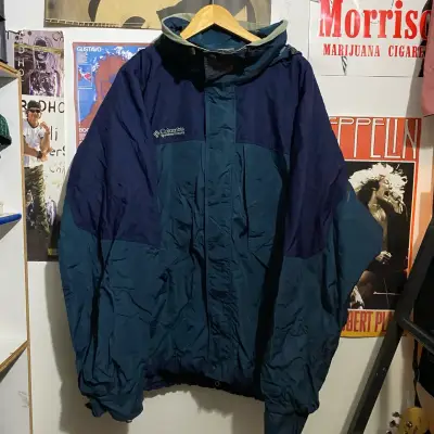 Chaqueta impermeable Columbia azul con capucha - miniatura 1