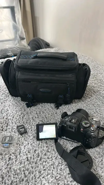 Cámara Canon con bolso Samsonite y accesorios - miniatura 3