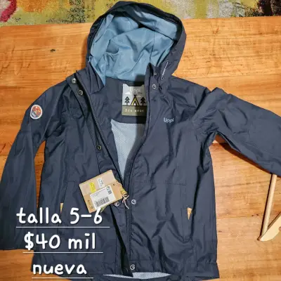 Chaqueta impermeable azul talla 5-6 nueva - miniatura 1