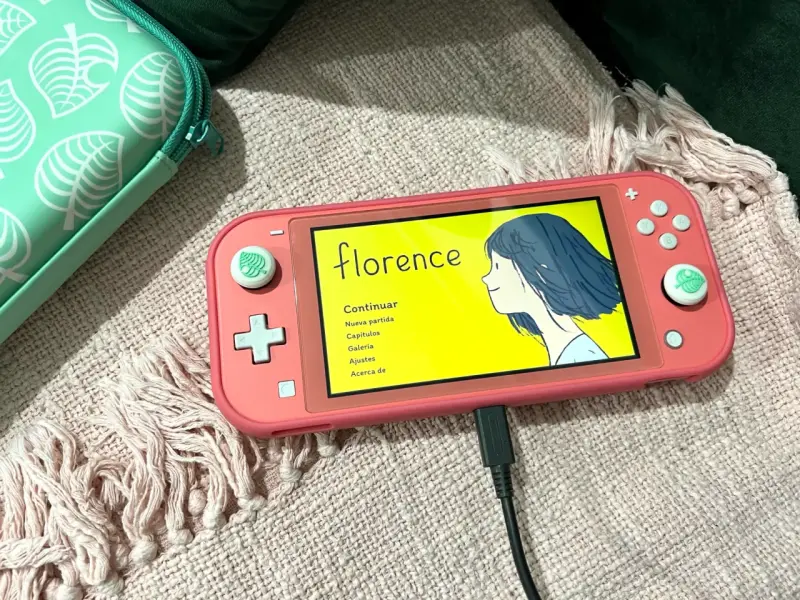 Nintendo Switch Lite coral con funda y accesorios - 1