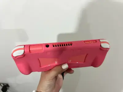 Nintendo Switch Lite coral con funda y accesorios - miniatura 6
