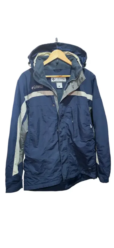 Chaqueta impermeable Columbia azul con capucha - miniatura 1
