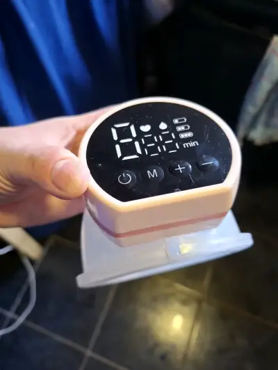 Extractor de leche eléctrico portátil con pantalla LED - miniatura 1