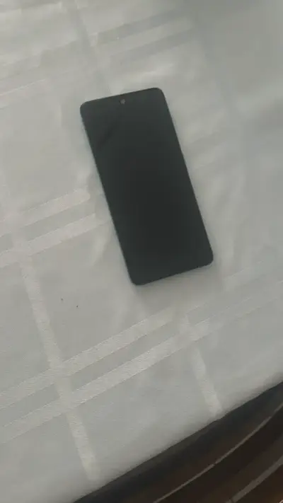 Smartphone azul en buen estado - miniatura 1