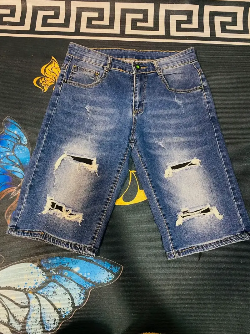 Bermudas de mezclilla desgastadas para hombre