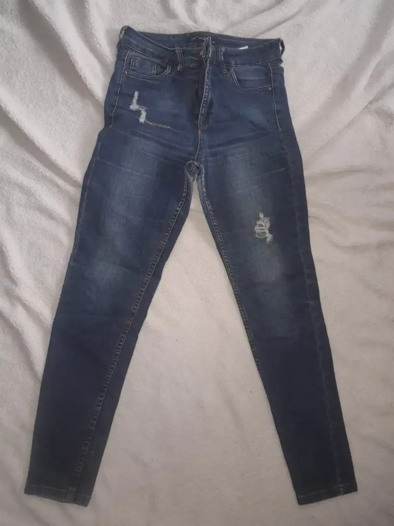Jeans ajustados de mezclilla azul desgastados - 1